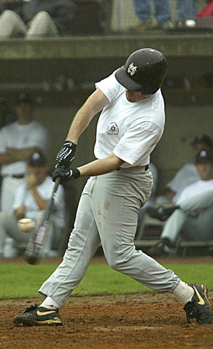 A Diamond Dawg alumnus makes contact with a pitch.