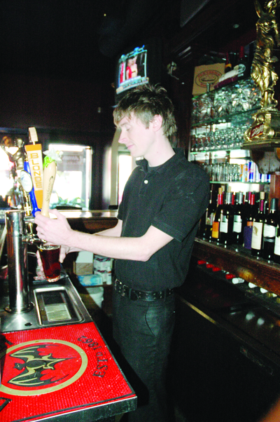 Old Venice Pizza Co. bartender Ben Hodge pours beer from Lazy Magnolia Brewing Company in the restaurants bar. The company serves approximately 300 restaurants, bars and groceries across the state.