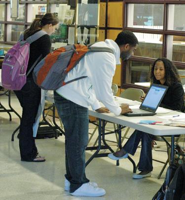 Students cast their vote in the Mitchell Memorial Library during Tuesdays election. 2.5 percent of students voted for a third-party candidate.