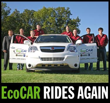 Leaders of the 2009 EcoCAR team from left, Marshall Molen, faculty sponsor, Michael Barr, Josh Hoop, Ryan Williams, Elizabeth Butler, Matthew Doude, Julian McMillian and James Felkins stand with the teams highly modified, ecologically friendly Saturn Vue
