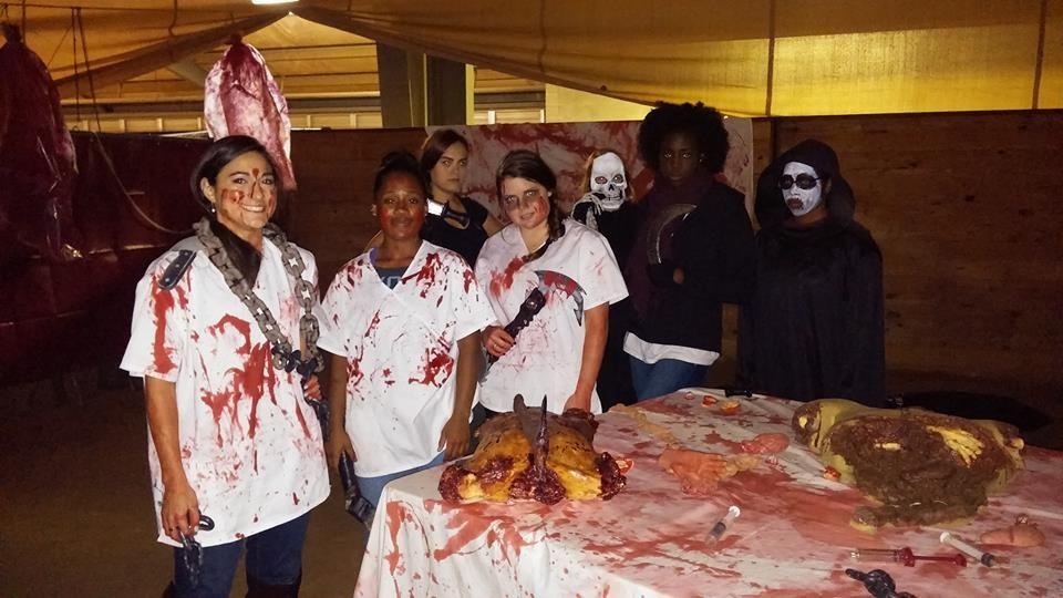 Volunteers staff gruesome event stations and prepare makeup behind the scenes as MSU students and members of the Starkville community line up to enter last year’s Haunted Horse Park event.  