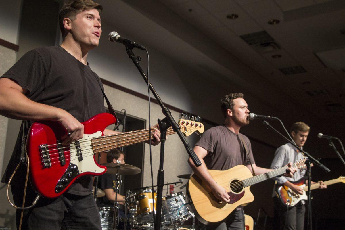 Jake Slinkard (middle guitarist) and his band perform at the Battle of the Bands hosted by Music Maker Production this past Thursday night. 