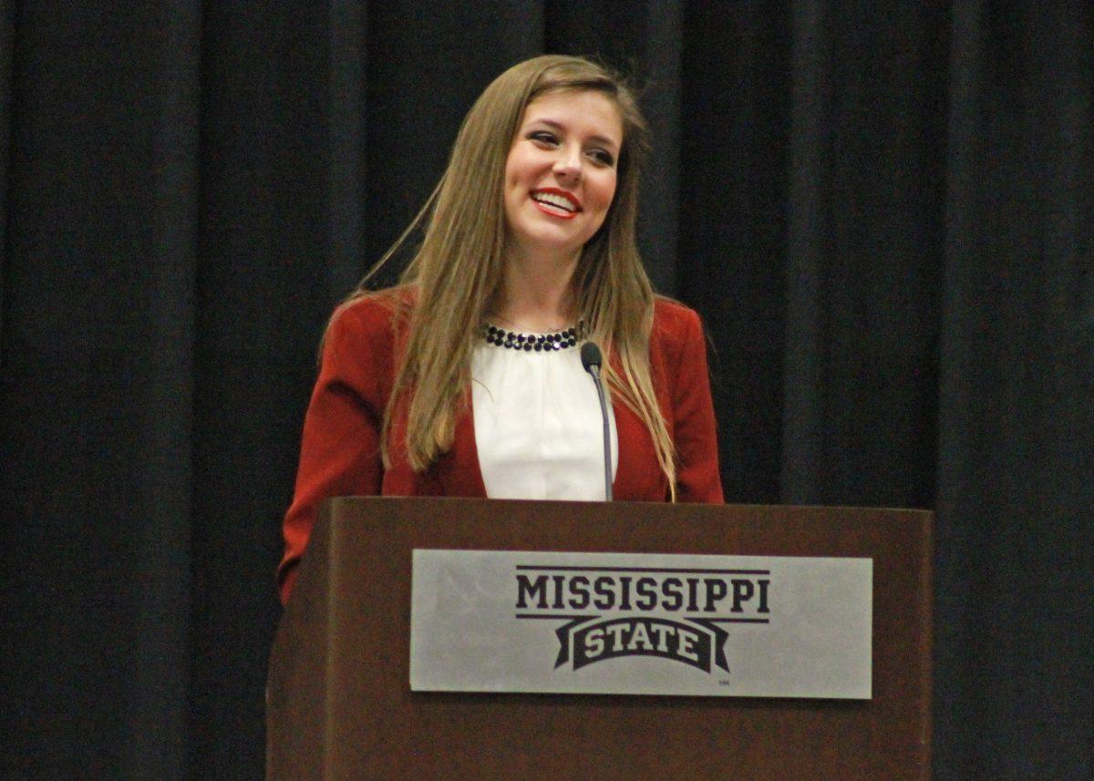 Tyler McMurray, unopposed runner for SA president, smiles as she addresses those present with a speech explaining her platform.&#160;