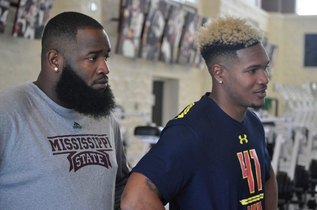 Fred Ross and A.J. Jefferson look on during MSUs Pro Day.
