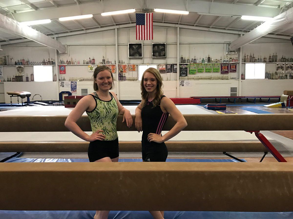 Mikhaila+Selby+and+Brie+Bibel+stand+in+front+of+balance+beams+at+the+Academy+of+Competitive+and+Performing+Arts.+Selby+and+Bibel+are+creating+MSU%26%238217%3Bs+first+club+gymnastic+team+incorporating+their+love+for+gymnastics+with+their+love+for+Mississippi+State.%26%23160%3B