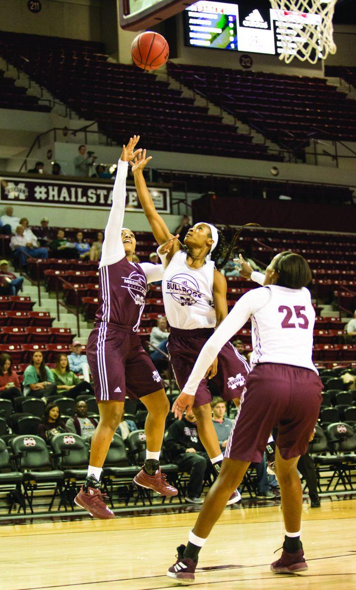 Victoria Vivians takes a shot over MSU defenders in the Maroon White scrimmage on Wednesday.