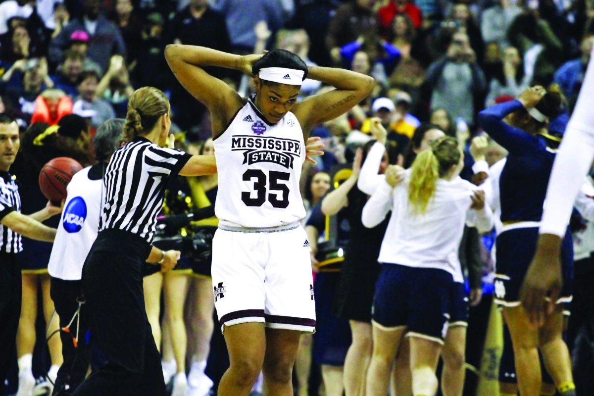 Victoria+Vivians+walks+to+the+bench+as+Notre+Dame+celebrates+their+buzzer-beating+win+over+MSU+in+the+National+Title+Game.