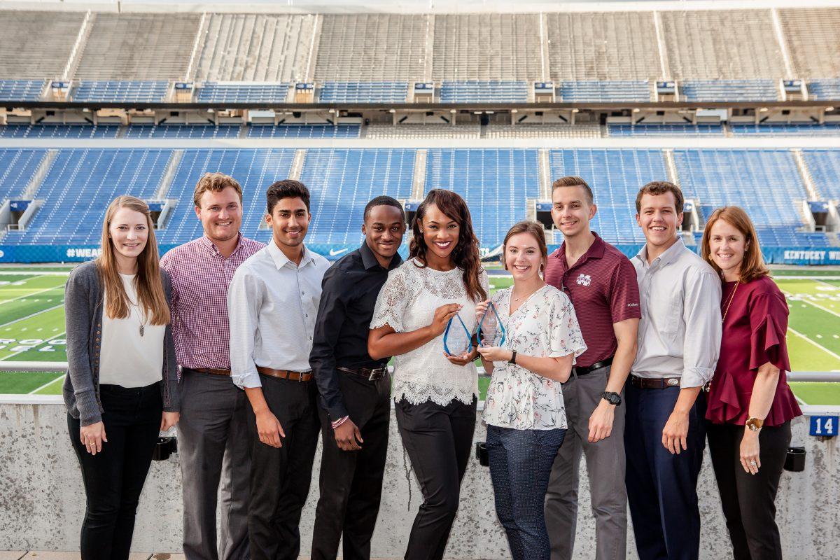 Members of MSUs Student Association pose with their awards in front of Kroger Field at the University of Kentucky.