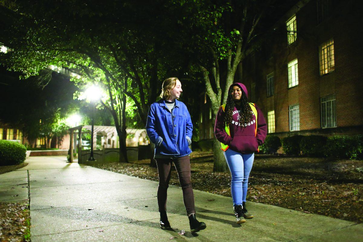 Junior educational psychology major Troynesha Lewis (right) walks Meridian native Grace Goodman across campus as part of the MSU Police Departments new safety program, Safe Walk.