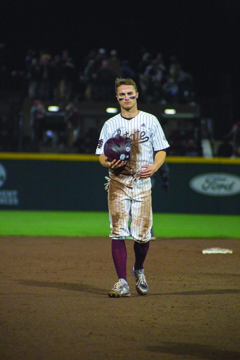 Jake Mangum walks back to the dugout after MSU strikes out against the University of Alabama Birmingham.