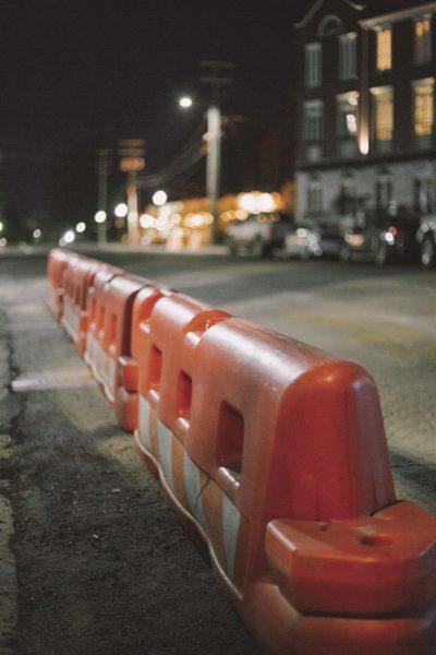 Police barriers mark off the intersection of Maxwell Street and University Drive.