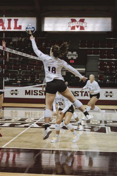 Lauren Myrick, sophomore outside and right side hitter from Louisville, Kentucky, goes up for a hit in Saturday’s match between the Bulldogs and Aggies where Myrick totaled 12 kills.