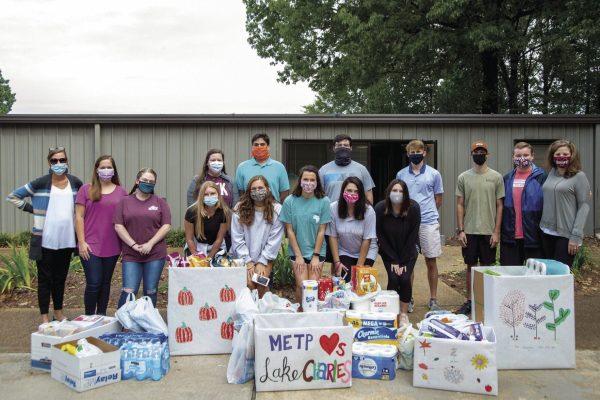 METP students pose with the goods they collected to send to the Lake Charles, Louisiana, community after it was affected by recent hurricanes.