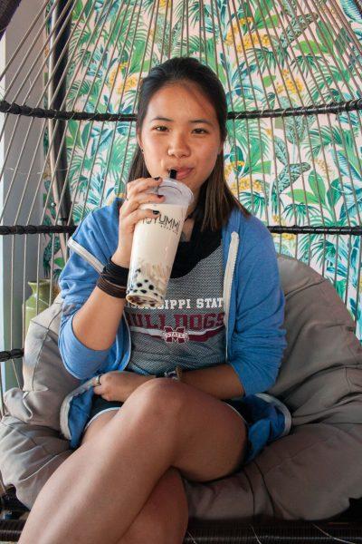 Mississippi State University student Shali Rader enjoys boba at T-YUMMI on Friday afternoon.