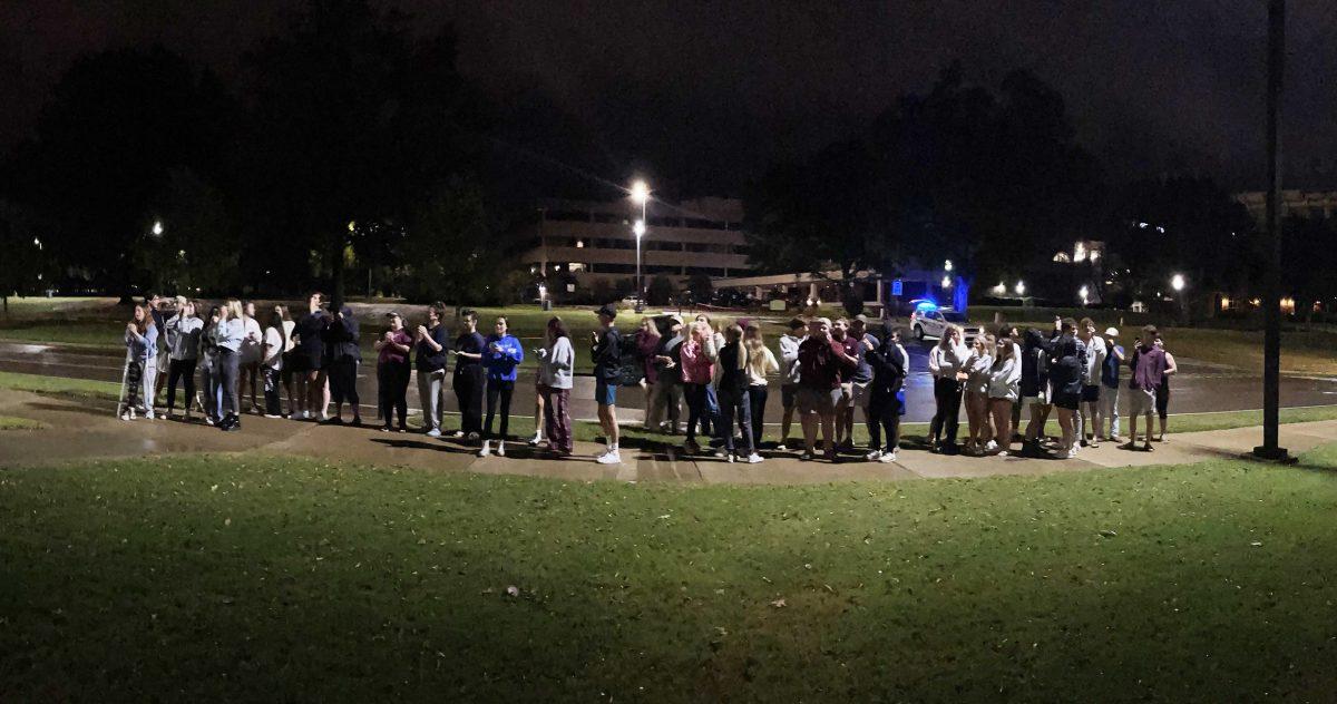 <p>Students gathered near the front lawn of the Pi Kappa Alpha fraternity house on Wednesday night.</p>
