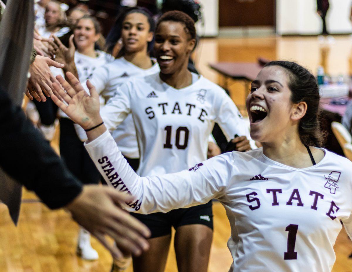 The Mississippi State volleyball team greets fans after a recent win against Alabama. The VolleyDawgs are now locked into 2nd place in the SEC.