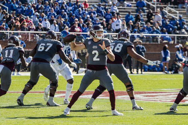 Will Rogers attempts a pass in action against Tennessee State.
