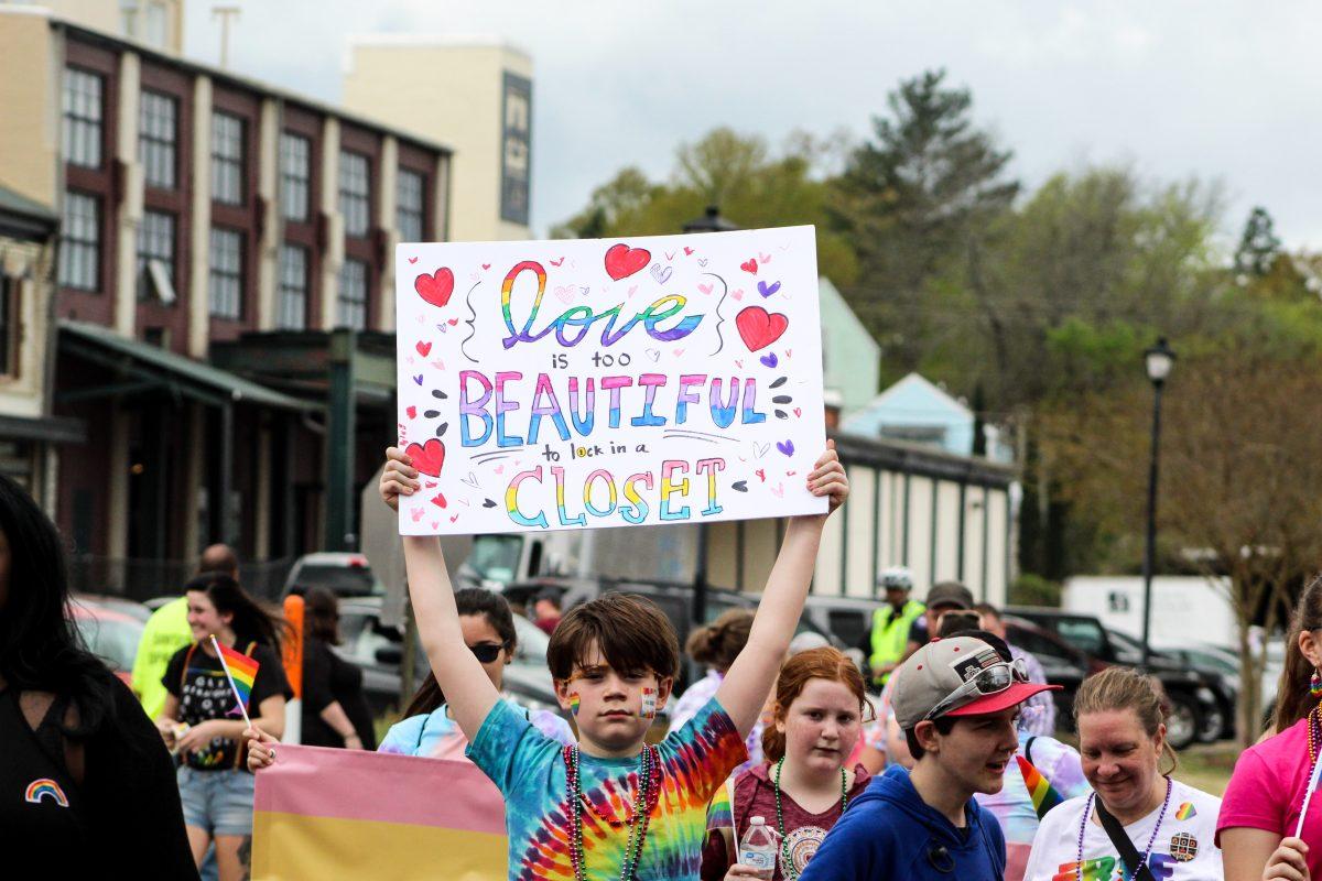 Citizens+of+all+ages+walk+while+carrying+supportive+signs+at+the+2019+Starkville+Pride+parade.+This+sign+reads%2C+%26%238220%3BLove+is+too+beautiful+to+lock+in+a+closet.%26%238221%3B