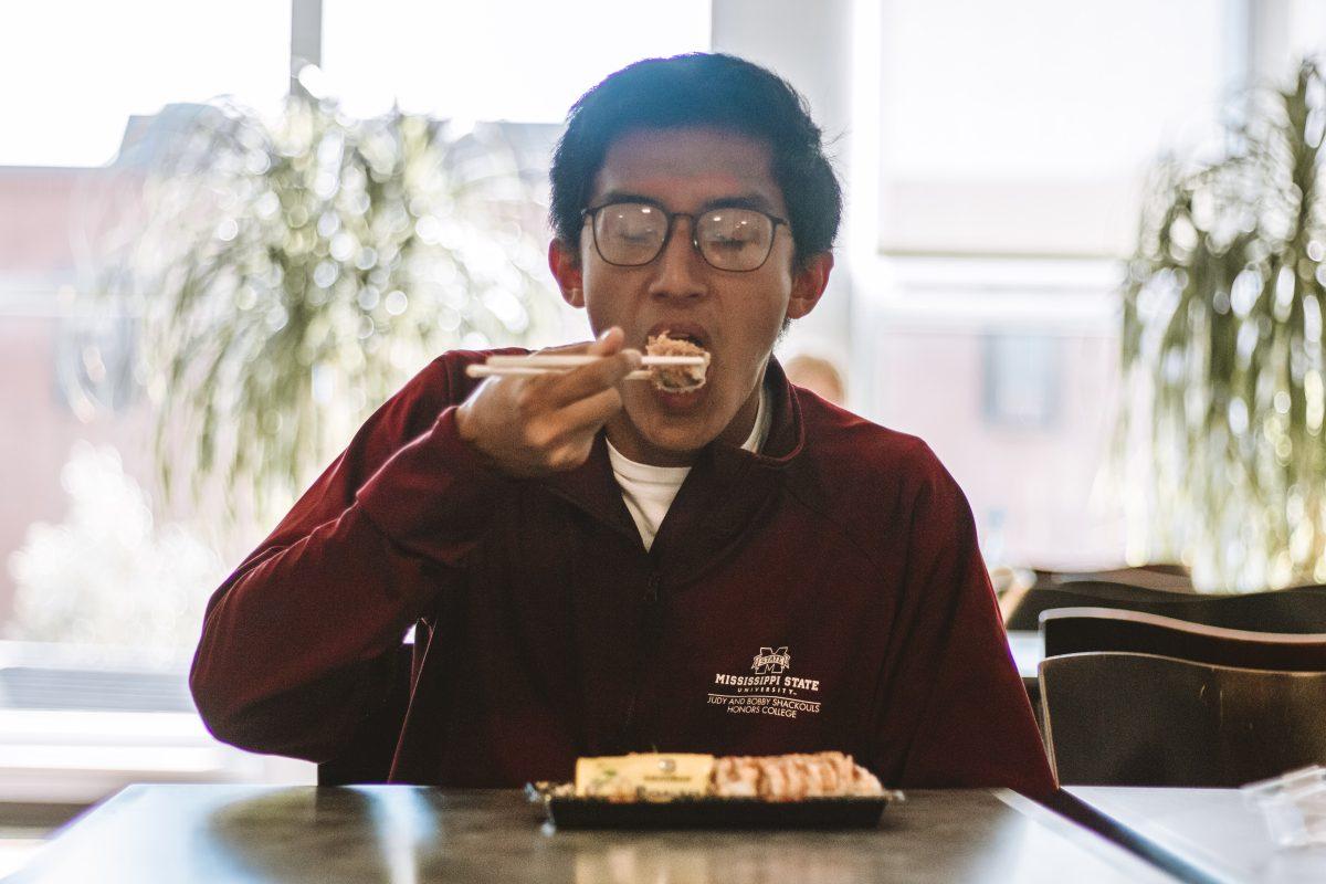 Brannan Tisdale, a junior geoscience major, eats sushi from the P.O.D. on the third floor of the Colvard Student Union.
