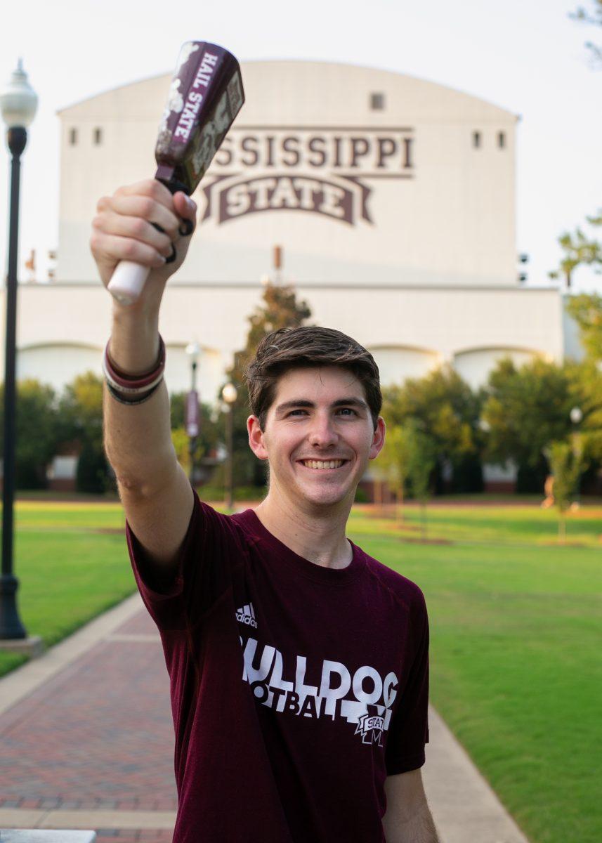 Alex Howell rings his cowbell at every home football game as a member of the band.