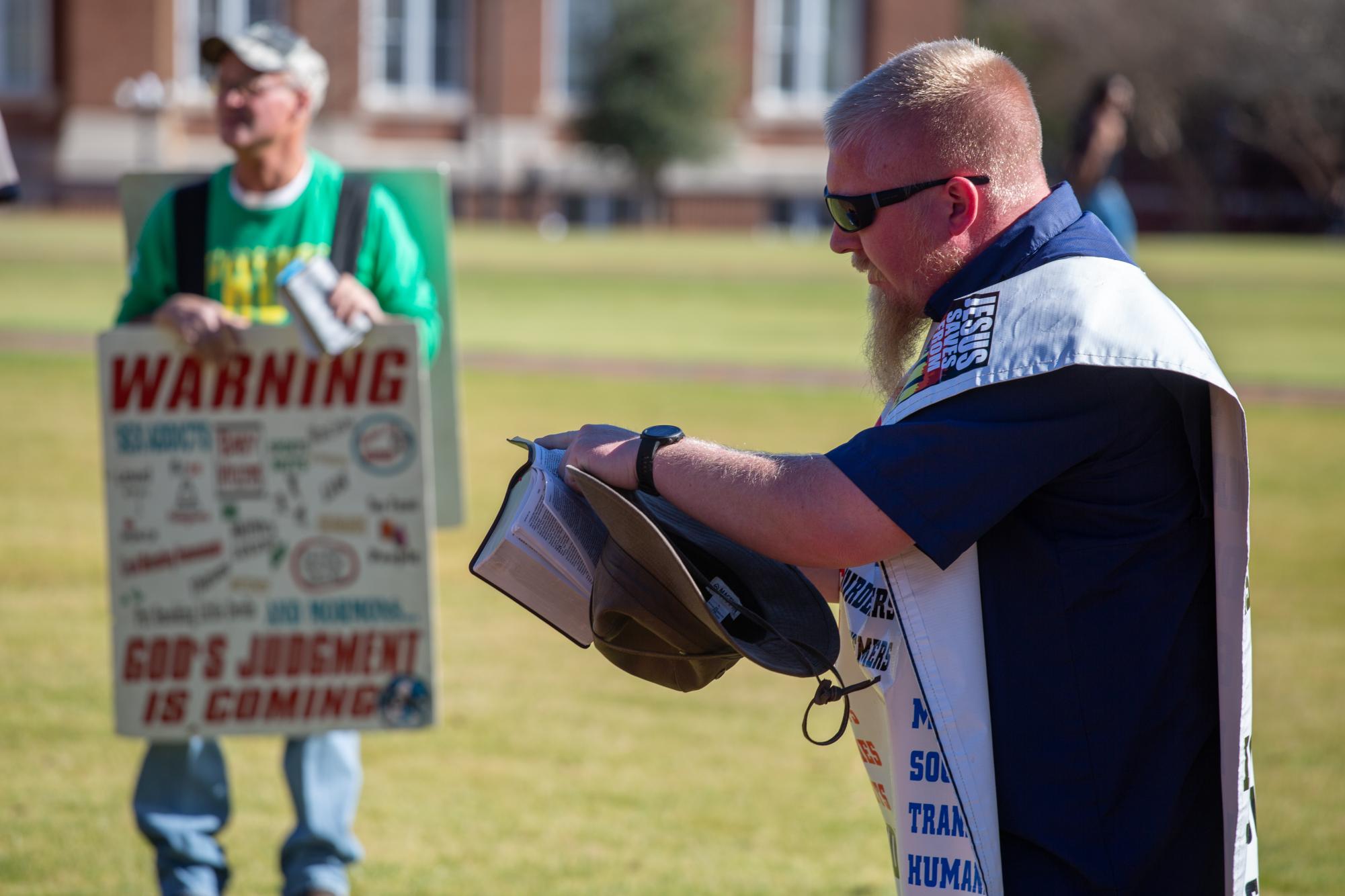 Mississippi State students walk by drill field protestors often.