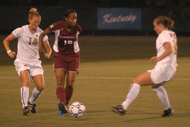 Junior Ngum Suh tries to split two Missouri Tigers. The Bulldogs won 1-0.