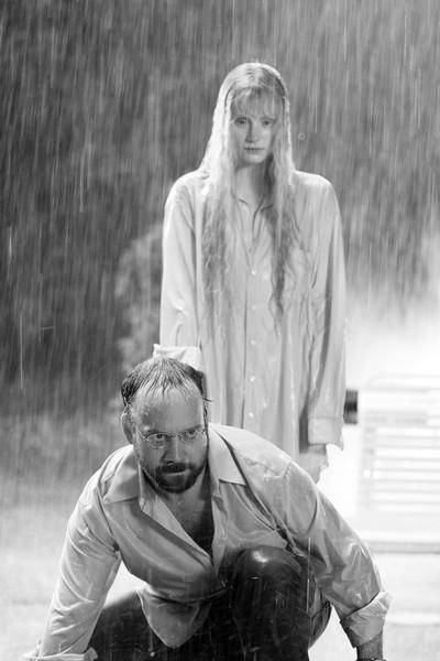 Paul Giamatti senses Bryce Dallas Howard behind him in a scene from M. Night Shyamalans Lady in the Water.