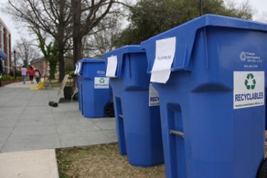 Placed by MSU Recycling Club for Green Day, recycling bins marked for a range of materials, stand outside the Union.