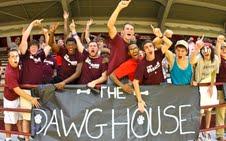 Members of the student support group The DawgHouse cheer during a volleyball match in the Newell Grissom Building. The support group was founded earlier this season and presents a spirit that gives the team a true home-court advantage. 