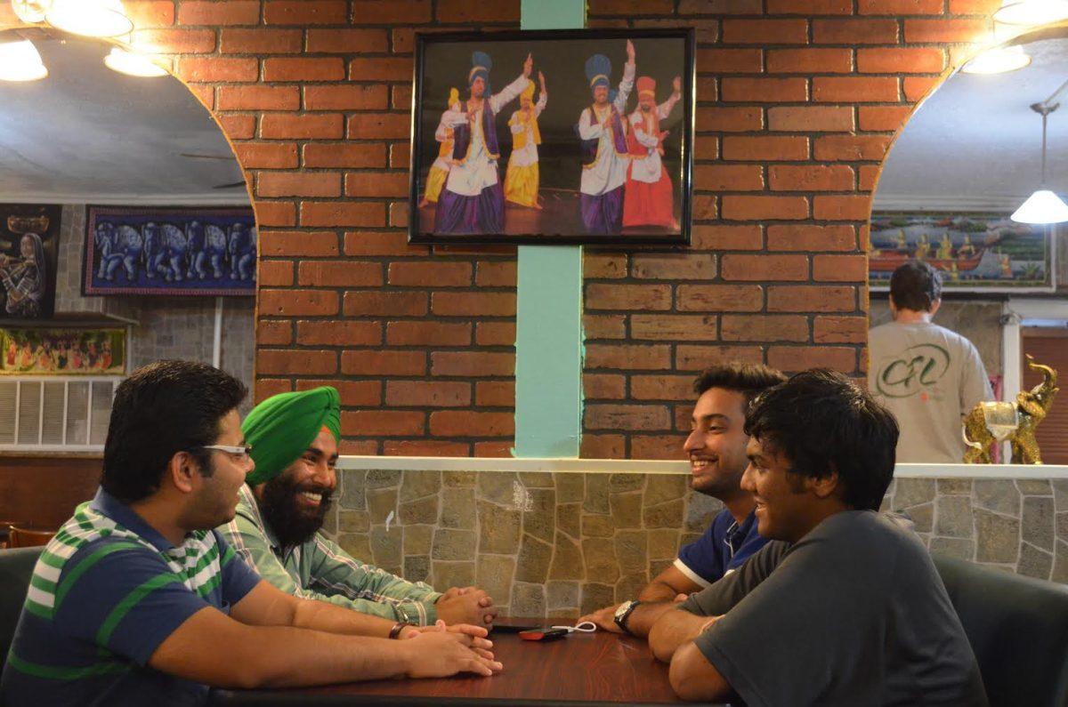 A new restaurant called ‘Flavors, Cuisine of India’ is now open in Starkville, Mississippi.  Paritosh Muley (left), Bhupinder Singh (left), Gourav Sharma (right) and Nikhil Lokhande (left) engage in conversation while awaiting their orders. 