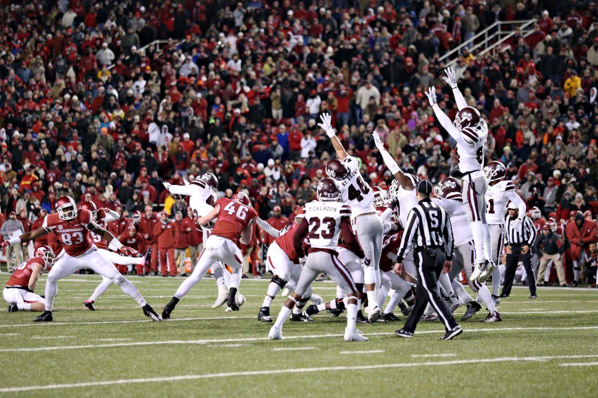  The Mississippi State University Bulldogs pulled off a 51-50 win against the Arkansas Razorbacks Saturday night. Senior linebacker Beniquez Brown saved the game by blocking (pictured) a late field goal attempt by the Razorbacks, providing the Bulldogs momentum entering the Egg Bowl game. 