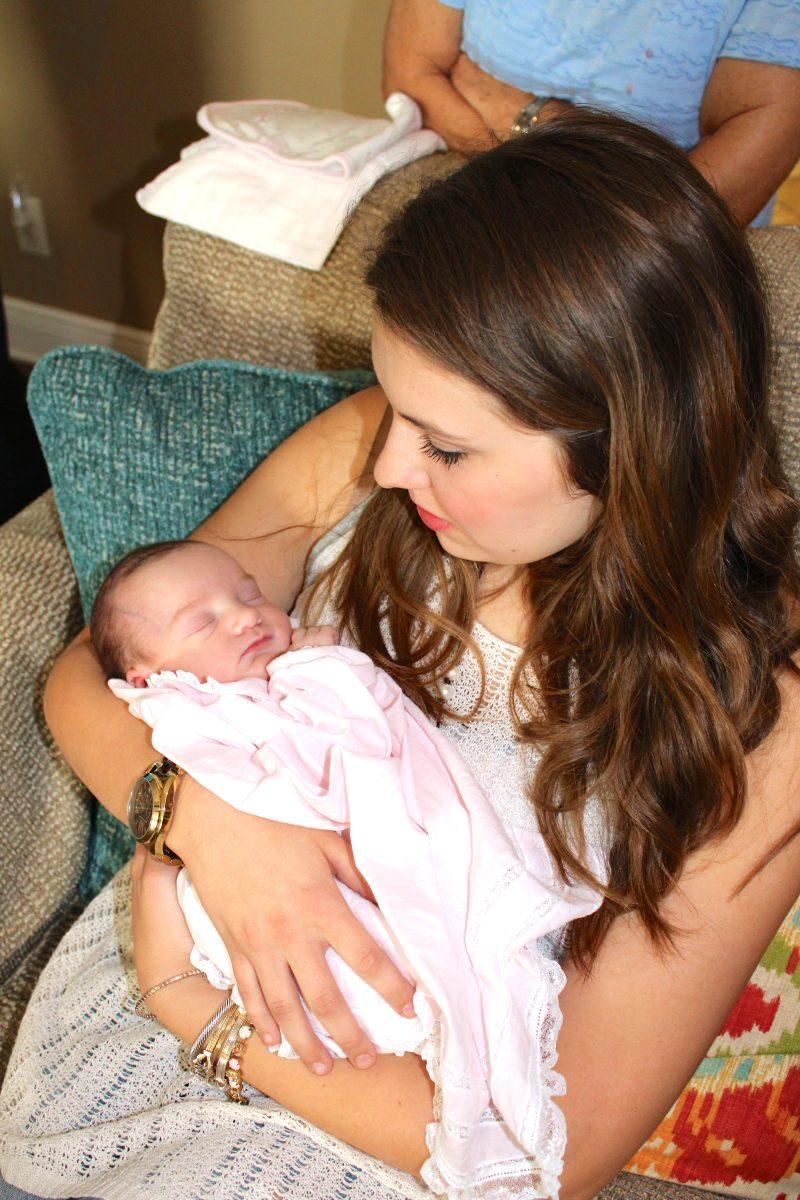 Abby Ready holds her newborn niece, Damie Katherine, (pictured) after Readys sister  and brother-in-law successfully completed the adoption process.