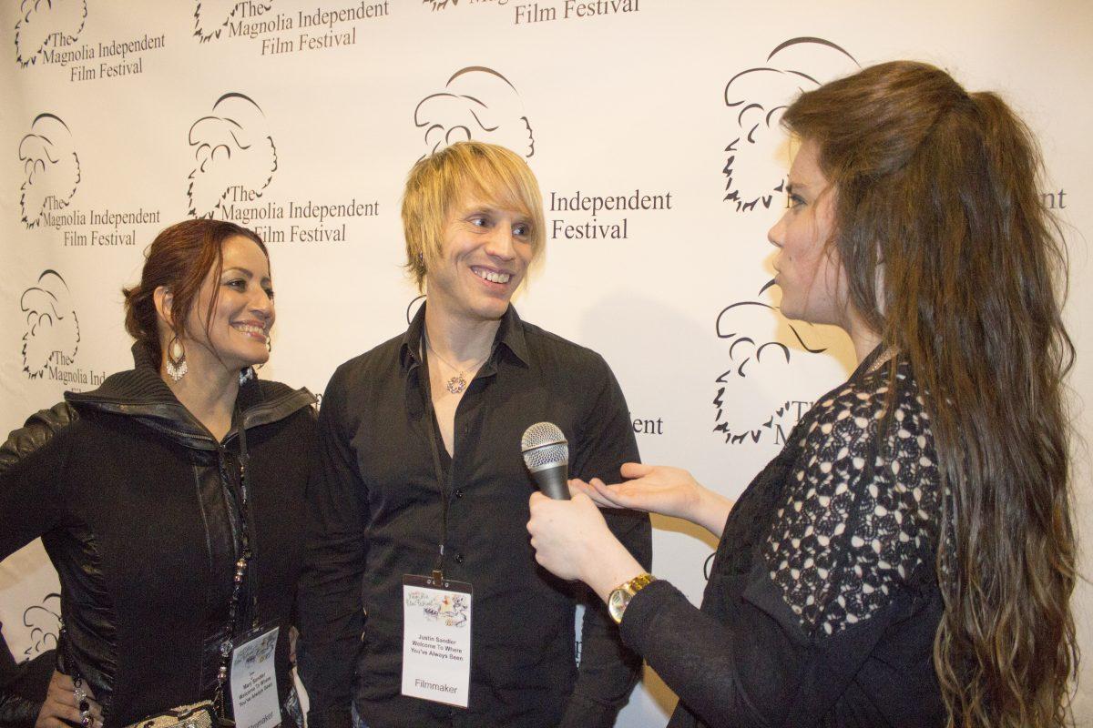 Justin Sandler (right) and Mary Lou Sandler (left) from California are interviewed by MSU labrats at Hollywood Premier Cinemas. 