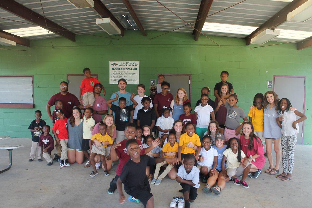 Mississippi+State+University+students+smile+with+children+at+the+Brickfire+Mentoring+Program.+The+children+come+from+low+income+families+in+the+Starkville+community+area.%26%23160%3B
