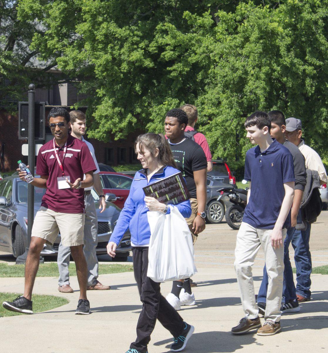 Aalaap Desai, senior biological engineering student, leads a group of prospective students and their parents around Mississippi State University&#8217;s campus on a sunny day.&#160;