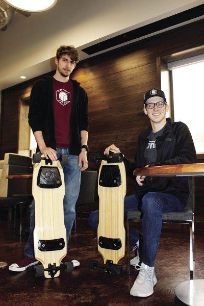  A patent-pending electromagnetic attachment system for longboards has been developed by seniors Brennan Bell (left) and Landon Casey (right), along with Ethan Schultz. This development will allow riders to attach themselves to their board via a handheld wireless remote-control. 