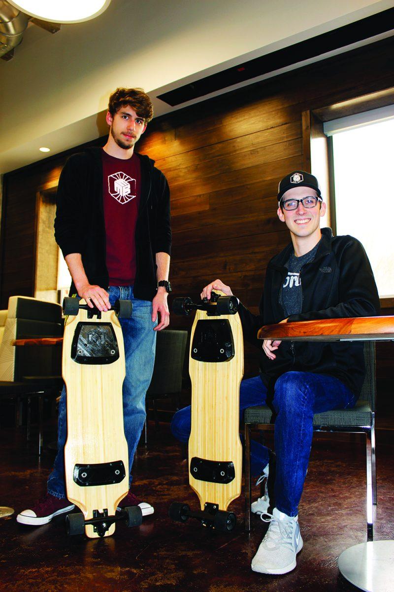  A patent-pending electromagnetic attachment system for longboards has been developed by seniors Brennan Bell (left) and Landon Casey (right), along with Ethan Schultz. This development will allow riders to attach themselves to their board via a handheld wireless remote-control. 
