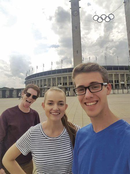 Left to right: Nathan Smith, Dani Schulze and Ethan Worch stand in front of Olympic Stadium in Berlin in the summer of 2017.