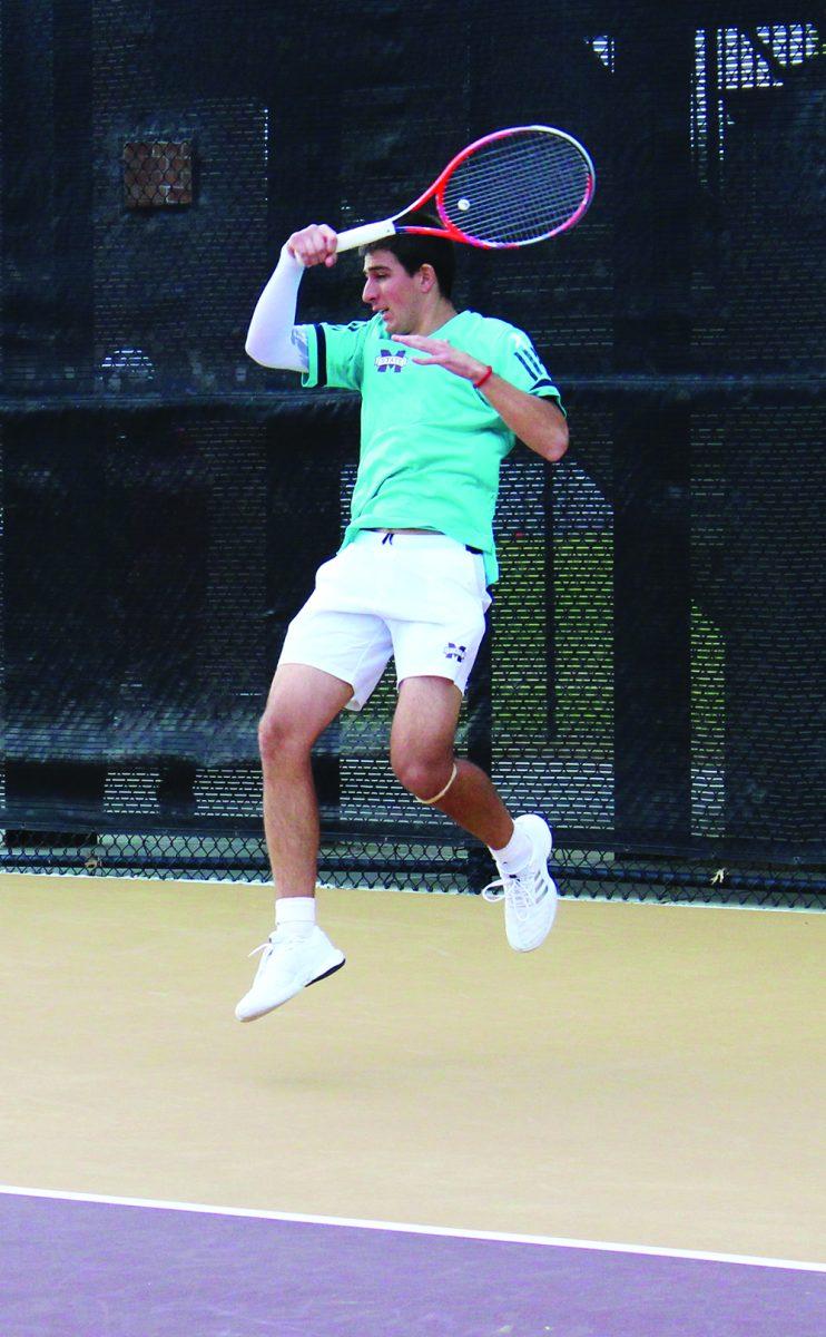 Strahjnia Rakic hits a volley in a match for MSU. Rakic and Nuno Borges are ranked number one in mens doubles nationally according to the Intercollegiate Tennis Association website.