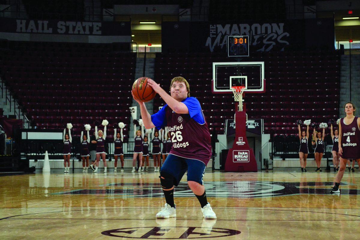 Access student Allan Burt plays basketball at the Hump in a game against Southern Mississippi during Magnolia Madness, put on by ESPN and the Special Olympics.
