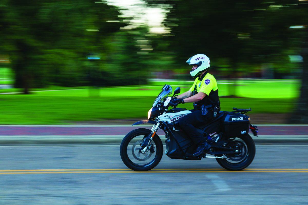 Officer Hickey of the MSU police department drives one of the two electric, fume-free &#8216;Zero&#8217; motorcycles that were recently purchased by the police department and the Office of Student Affairs.