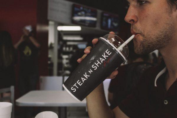 Eric Cleckner, junior mechanical engineering major, sipping a milkshake from Steak’n Shake. The new addition is located next to the campus post office.