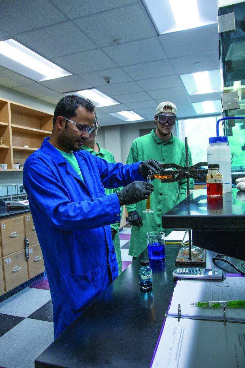 Mississippi State University chemistry graduate student Siddik Alom conducts experiments with his classmates as part of his coursework.