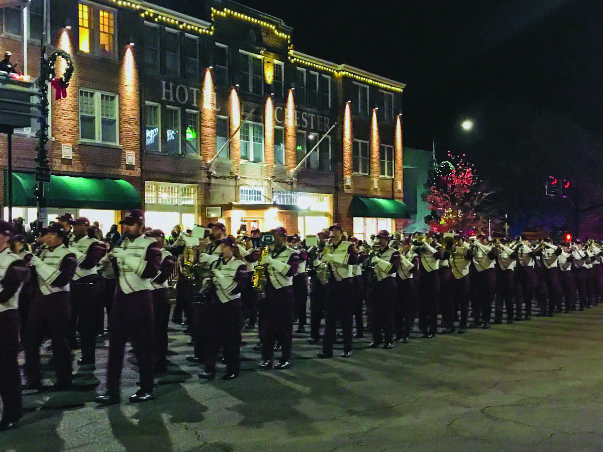 Mississippi State University’s Famous Maroon Band marches through downtown Starkville in last year’s annual Christmas parade.