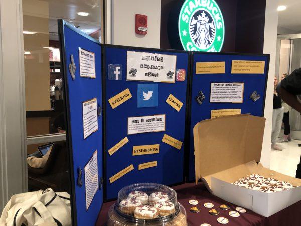 Santee Ezell-Johnson, assistant director of Health Promotion and Wellness, poses with donuts.donuts.