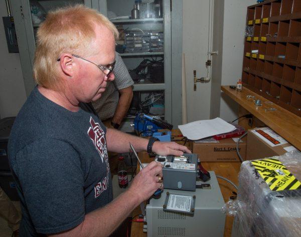 David Wallace, manager of Mississippi State University's Paul B. Jacob High Voltage Laboratory, provides a demonstration of the methods the lab has been using to convert 550 battery-powered ventilators to AC power to improve their usefulness for the Covid-19 crisis.
