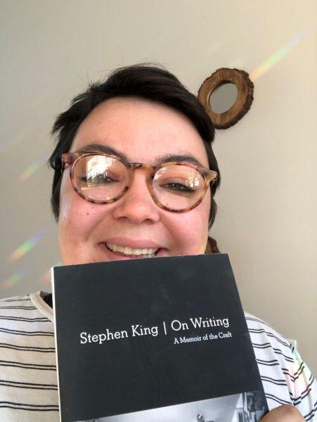 Rebecca Van Pamel, senior English major, is reading Stephen King's "On Writing".