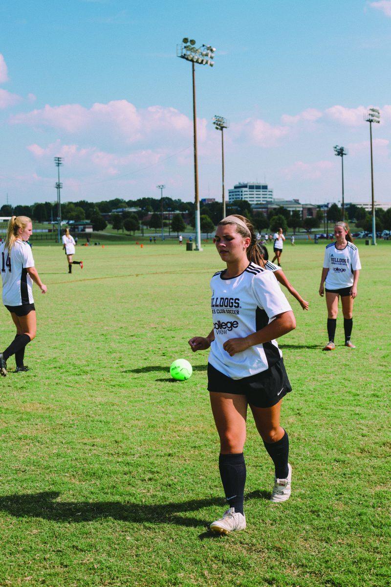 Sophomore Deme Courtney warms up for a club soccer game at the University of Alabama.