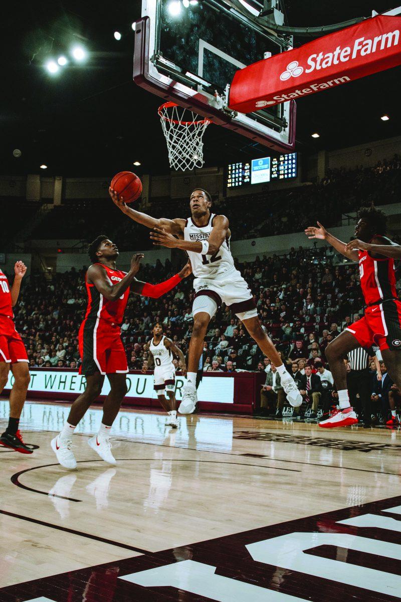 Robert Woodard II goes up for a shot during a match between the Mississippi State University Bulldogs and the University of Georgia Bulldogs during the 2019-2020 basketball season.