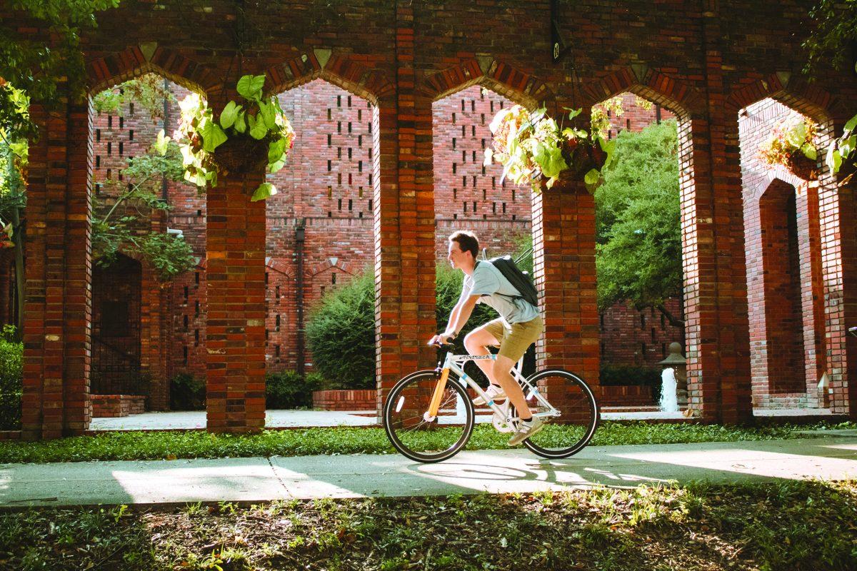 Junior J.T. Walter rides his bicycle this past Wednesday afternoon in front of the Chapel of Memories. Walter is one of the growing number of MSU students who ride their bikes on campus.